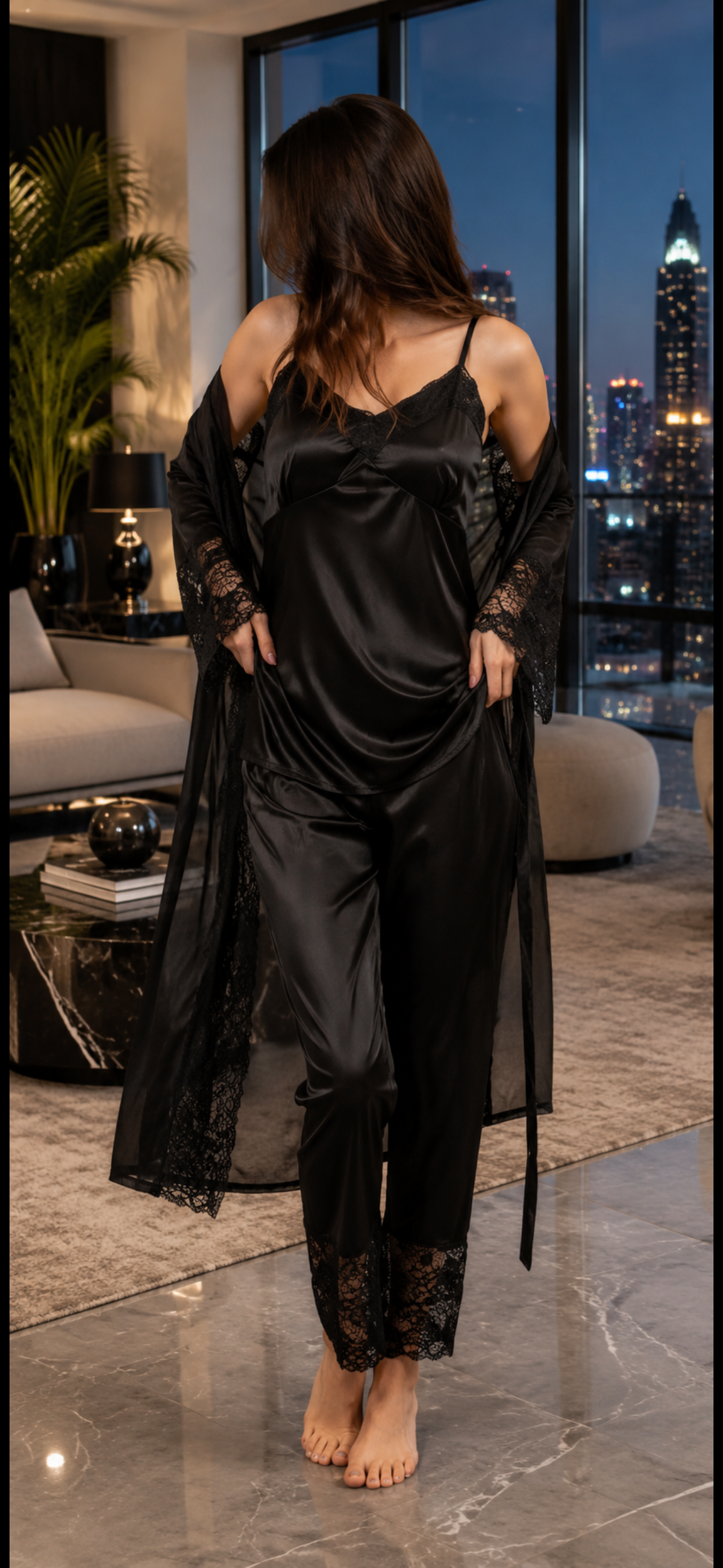 Front view of a black satin nightwear set with lace-trim camisole, matching pants, and sheer lace robe for elegant sleepwear.