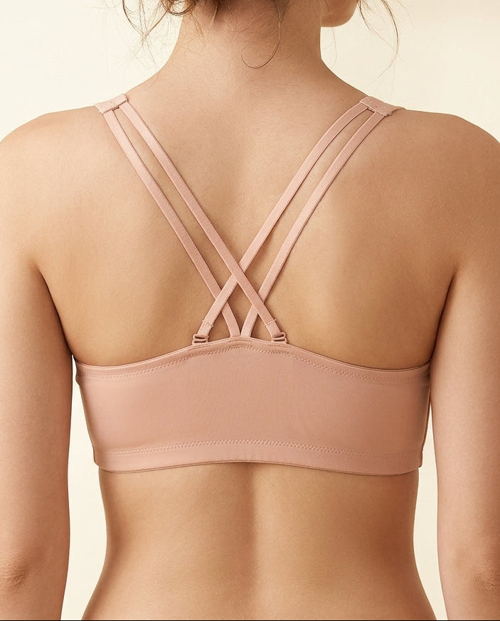 Back view of nude front-open bra highlighting the double crossover strap design and smooth band